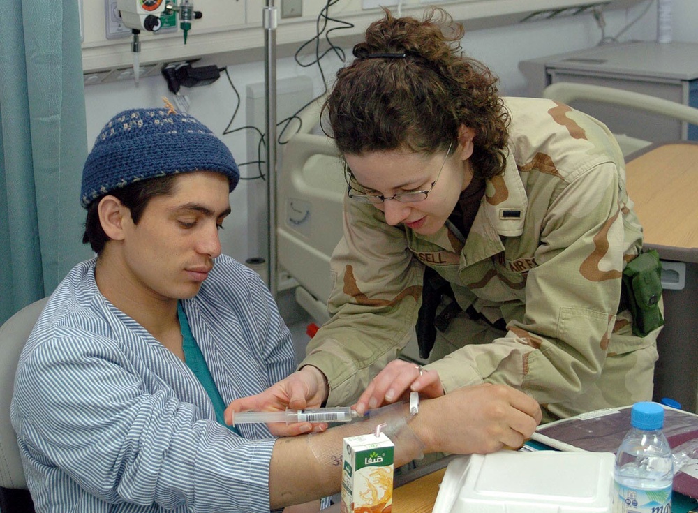 Nurse Provides Care to Patient at New Bagram Hospital