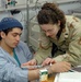 Nurse Provides Care to Patient at New Bagram Hospital