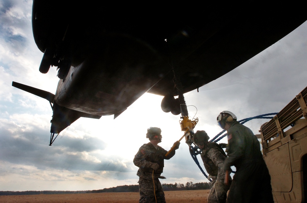 Navy Petty Officer Assists National Guard Soldiers in Sling Load Exercise