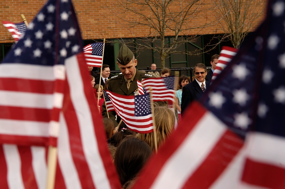 Gen. Pace Visits Elementary School, Greets Students Waving Flags