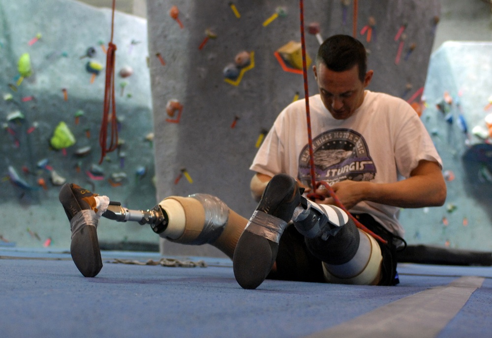 Wounded Warrior Scales Rock Wall with Prosthetic Feet