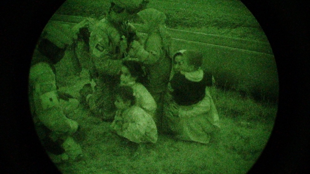 Coalition Forces Escort Iraqi Civilians to Safety After Raid on Suspected Terrorist Safe House