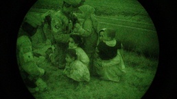 Coalition Forces Escort Iraqi Civilians to Safety After Raid on Suspected Terrorist Safe House