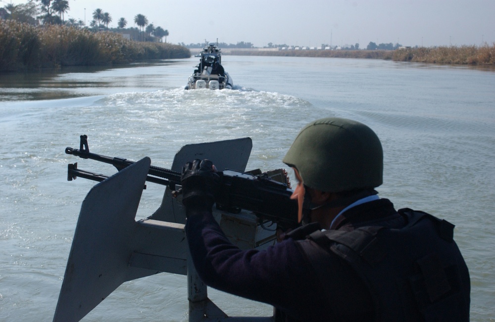 Iraqi Police Patrol Tigris River in Baghdad