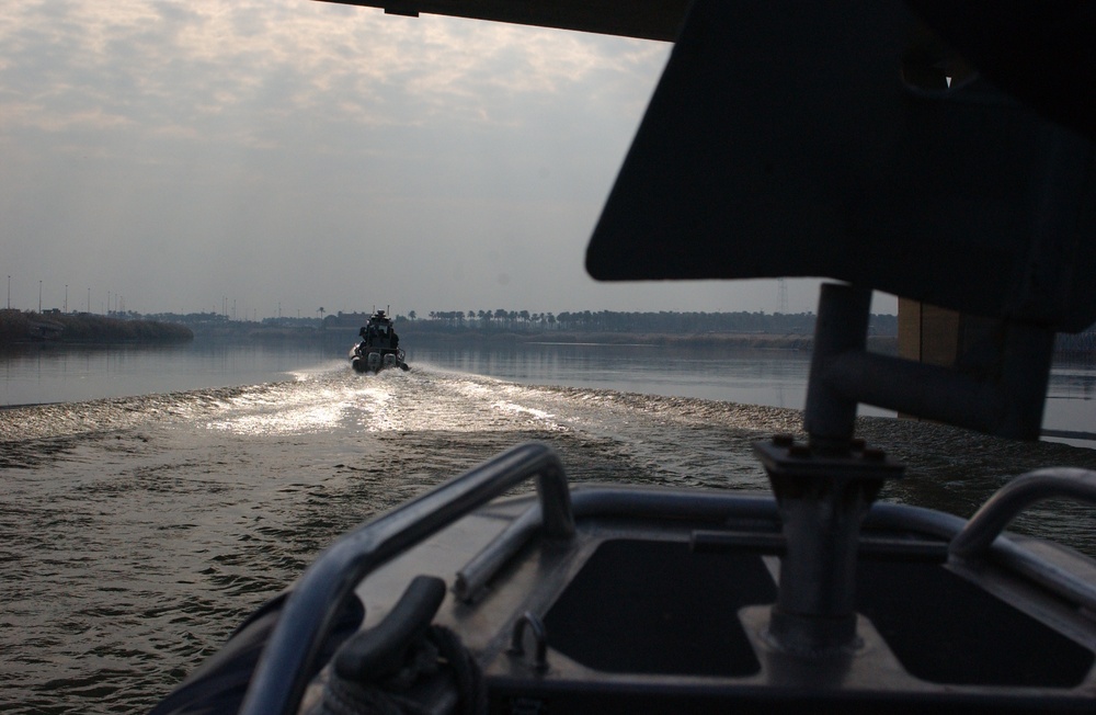 Iraqi Police Patrol Tigris River, Protect Key Bridge