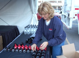 Bell Helicopter Employee Prepares for Armed Forces Bowl Giveaway at Sundance Square Pep Rally