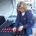 Bell Helicopter Employee Prepares for Armed Forces Bowl Giveaway at Sundance Square Pep Rally