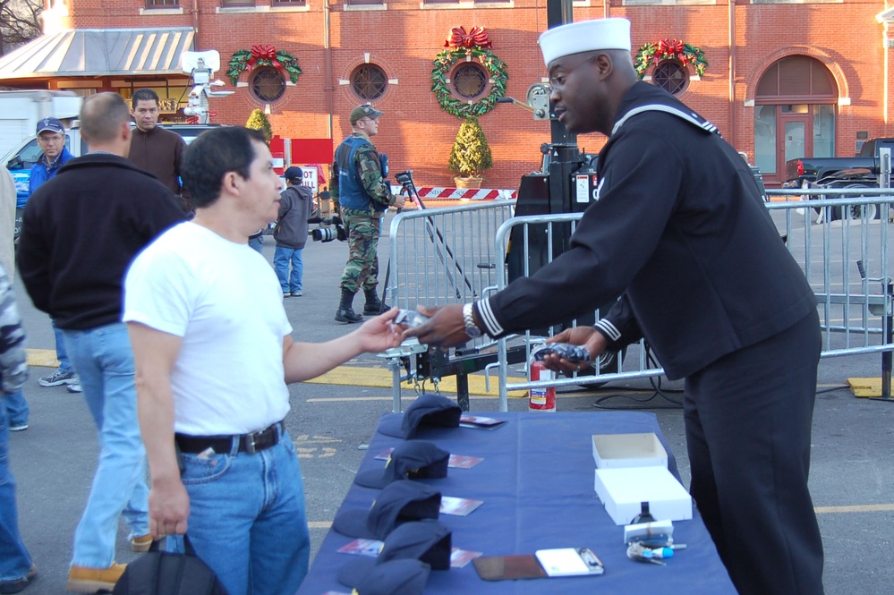 Navy Petty Officer Hands Out Swag at Armed Forces Bowl Pep Rally
