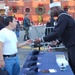 Navy Petty Officer Hands Out Swag at Armed Forces Bowl Pep Rally