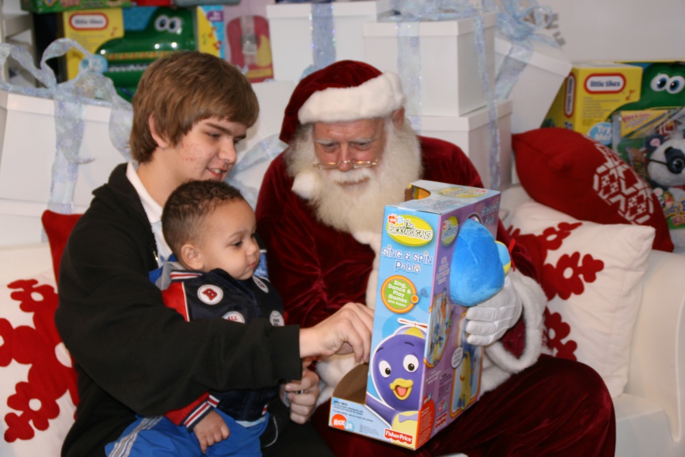 Young Brothers Delight in Visit with Santa