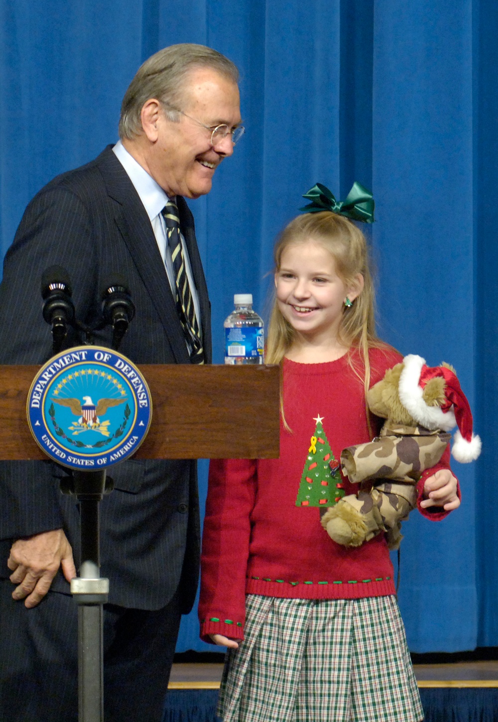 Rumsfeld Shares Smile with Young Troop Supporter at Pentagon Summit