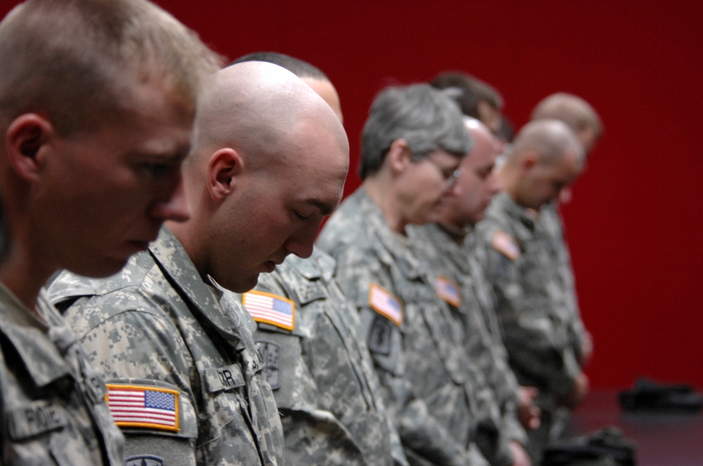 Solemn Tribute: Soldiers Honor Fallen Comrades at Memorial Wall Dedication