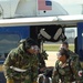 Medical Technicians Transport Patient from Helicopter During Exercise