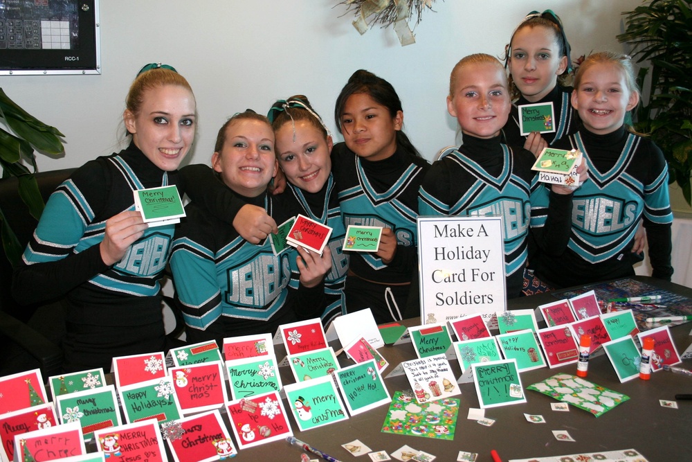Cheerleaders Make Hundreds of Holiday Cards for Troops at Competition