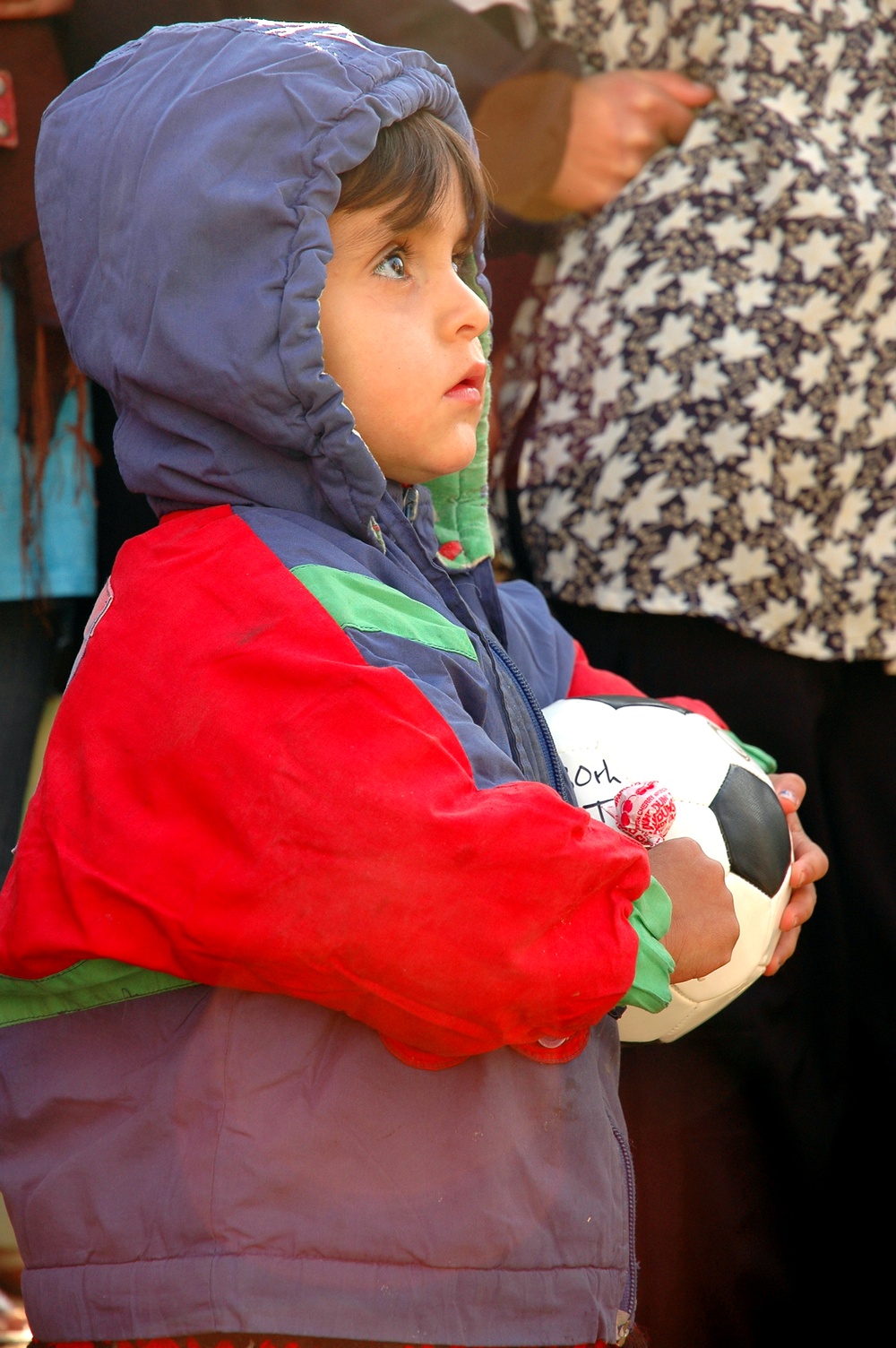 Orphan in Kabul Receives Soccer Ball Donation from U.S. Servicemembers