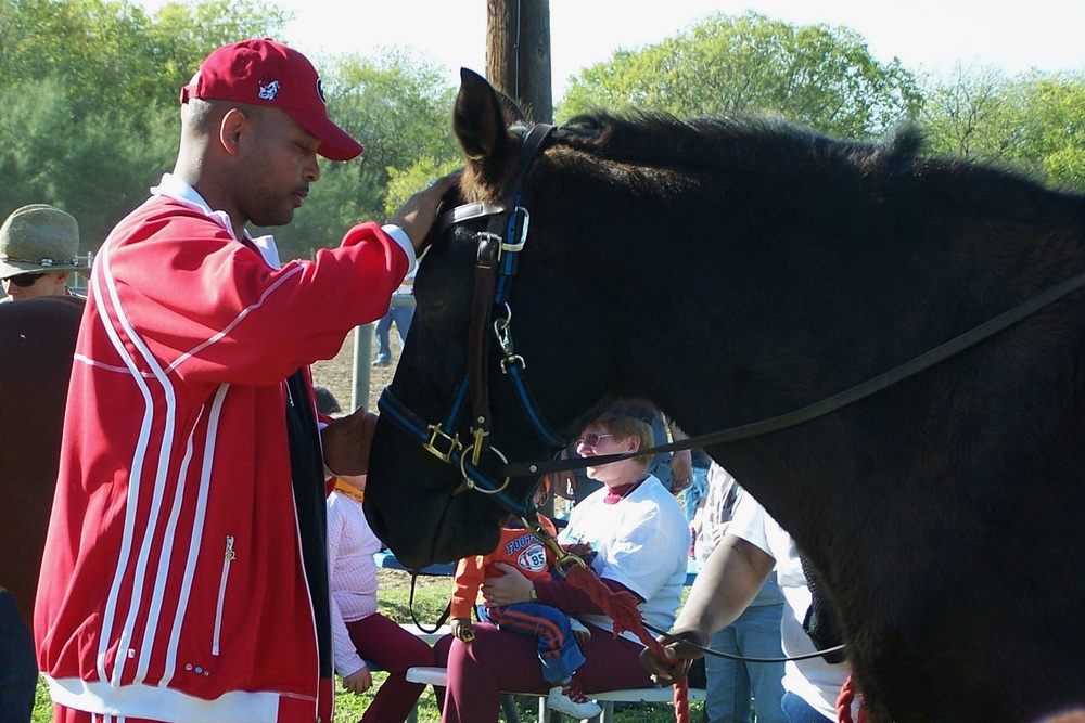 Army Sergeant Bonds with Therapy Horse at 'Horses for Heroes' Event