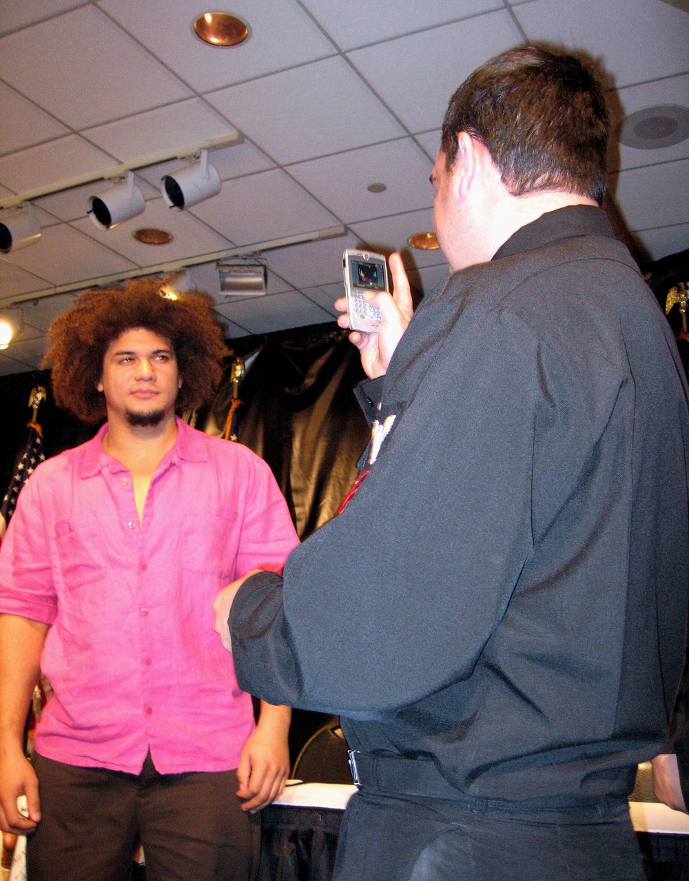WWE Superstar Carlito Poses for Photo with Navy Petty Officer at Troop Support Event