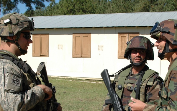 U.S. Army Soldier Engages with Afghan Counterparts During Joint Training Exercise
