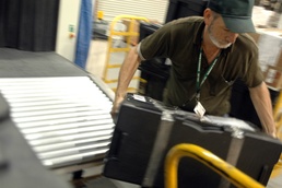 Contractor Handles Mail at Joint Military Terminal in Kuwait