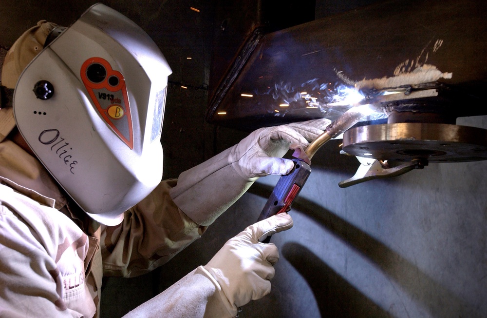 Welder Fuses Frame to Humvee Cab for Rollover Simulator