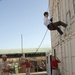 Manpower VP Rappels Down Shipping Containers in Bahrain Military Exercise