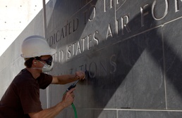 Contractor Chisels Lettering at Air Force Memorial