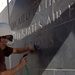 Contractor Chisels Lettering at Air Force Memorial