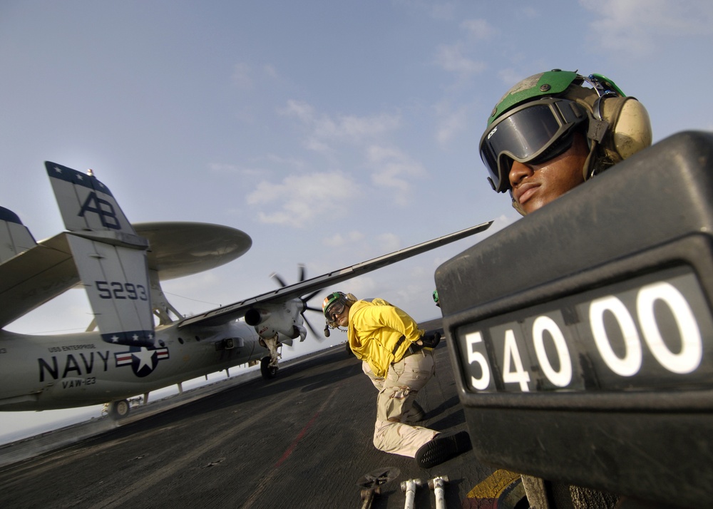 Navy Seaman Holds Weight Board for E-2C Hawkeye Launch Aboard USS Enterprise