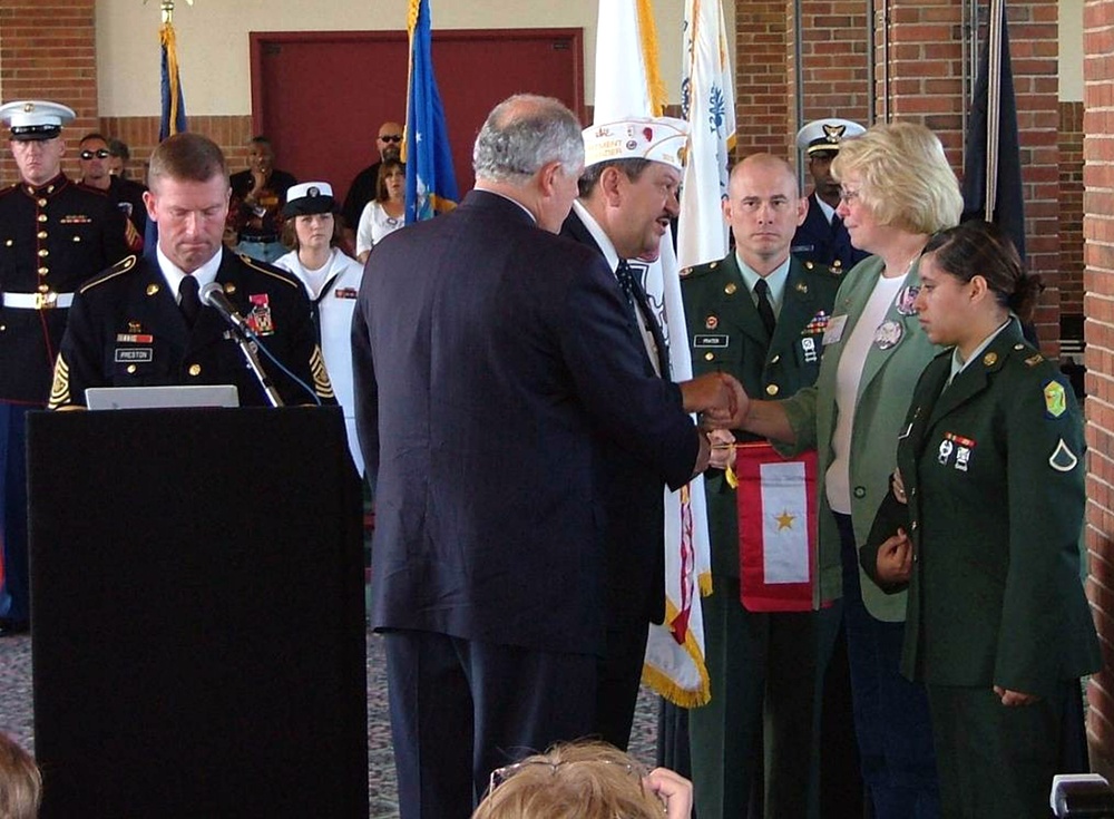 Gold Star Mother Receives Banner for Fallen Son in Iraq