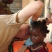 U.S. Army Officer Provides Medical Care to Beninese Girl in Africa