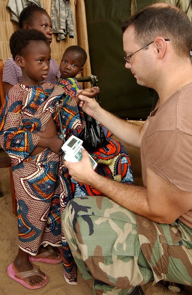 U.S. Army Medic Provides Care to Beninese Family During Medical Mission