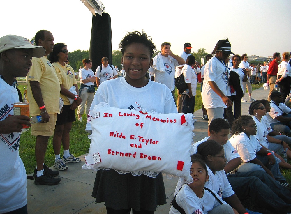 Elementary School Student Carries Pillow in 9/11 Memorial Walk