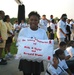 Elementary School Student Carries Pillow in 9/11 Memorial Walk