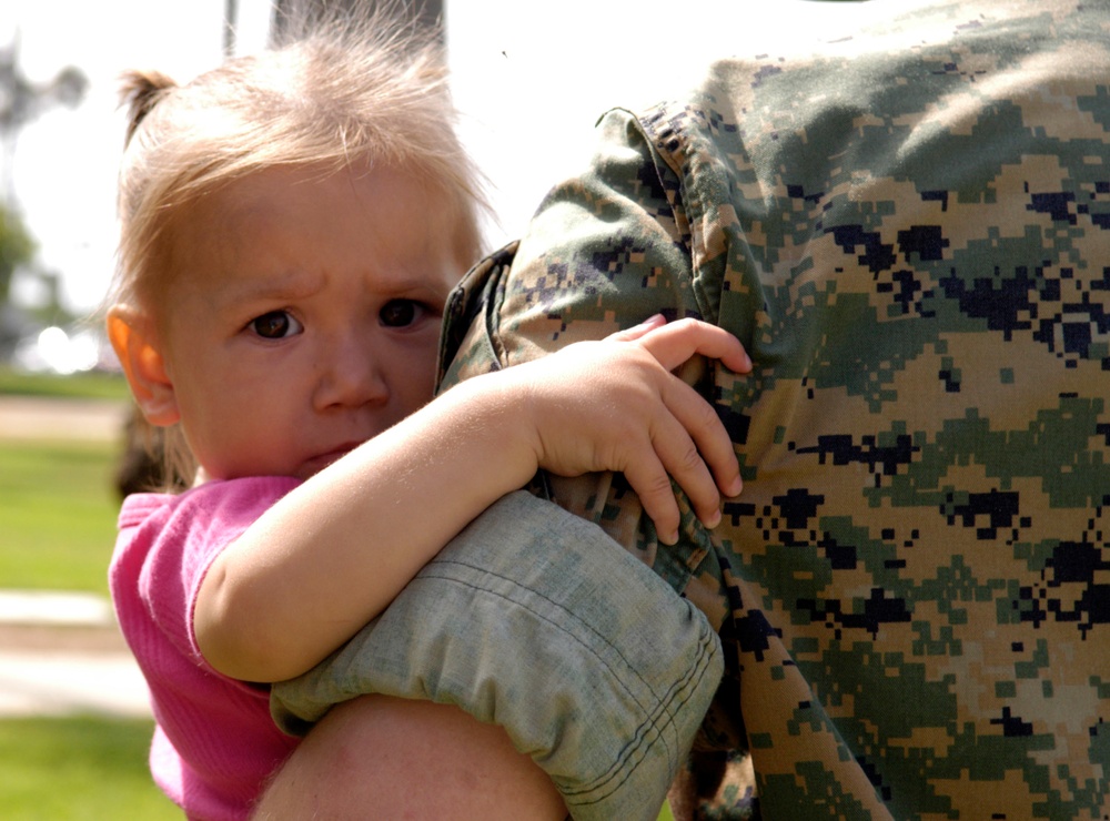 Marine Father Embraces Daughter Before Deployment