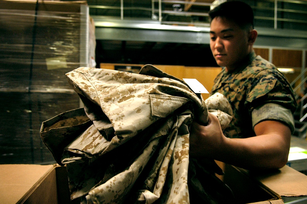 Marine Corps Cpl. Prepares Uniforms for Upcoming Deployment