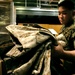 Marine Corps Cpl. Prepares Uniforms for Upcoming Deployment
