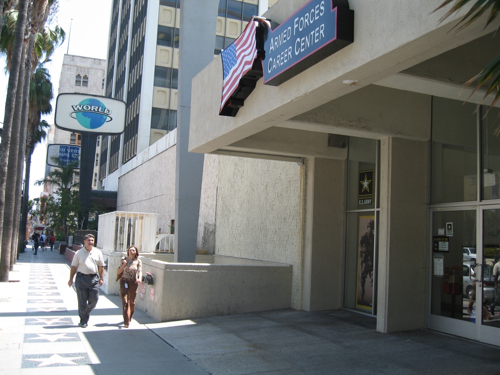 Pedestrians Pass by Armed Forces Career Center in Hollywood