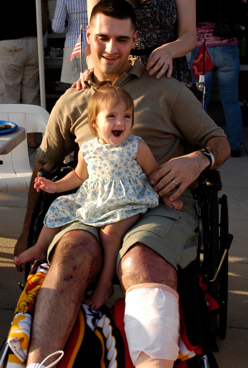 Marine Corps Lance Cpl. Reunites with Daughter at Free Dinner for Wounded Troops