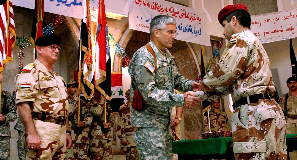 Iraqi and U.S. Commanders Exchange Gifts in Tikrit Ceremony