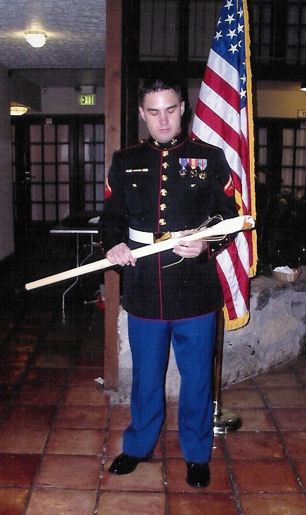 Marine Cpl. Tony Montgomery Holds Presentation Cane