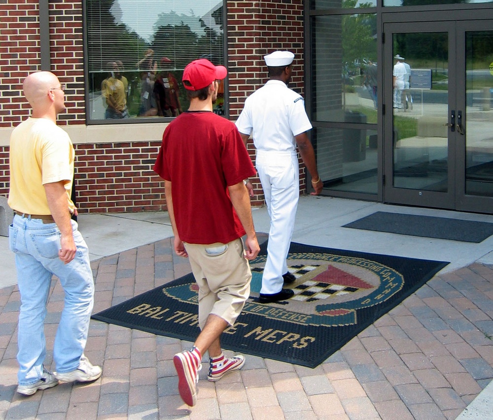 Navy Recruiter Guides Recruits into Baltimore Processing Station