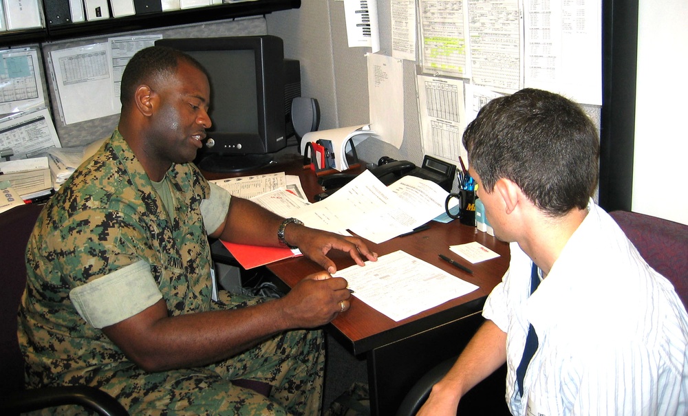 Marine Recruiter Reviews Contract with Prospective Recruit