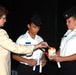 Montclair Woman Lights Candle at Memorial for Fallen Soldiers