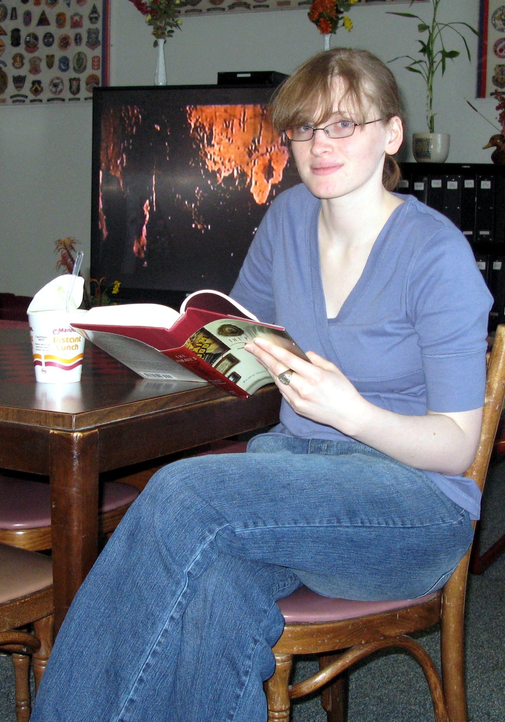 Navy Sailor Relaxes at USO Lounge Before Flight