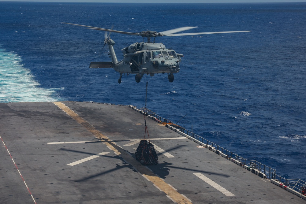 MH-60S Seahawks drop of supplies during USS Iwo Jima's RAS