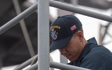 USS PEARL HARBOR (LSD 52) deck department Sailors perform corrosion control
