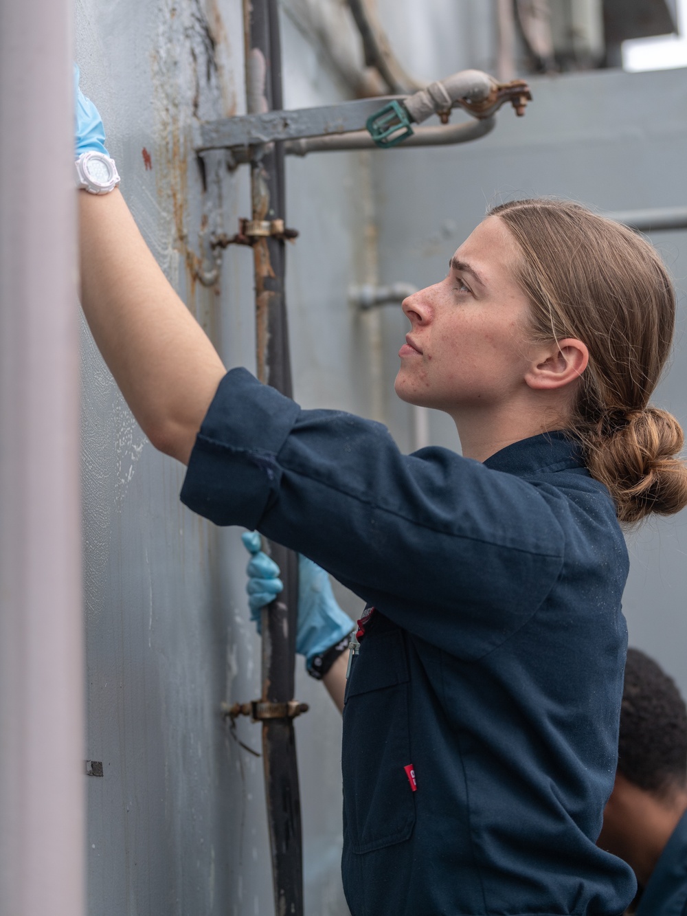 USS PEARL HARBOR (LSD 52) deck department Sailors perform corrosion control