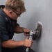 USS PEARL HARBOR (LSD 52) deck department Sailors perform corrosion control