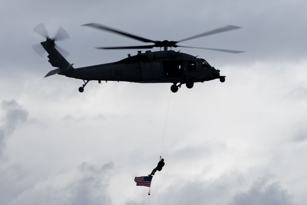 Helicopter Flies American Flag During The Fouth Of July