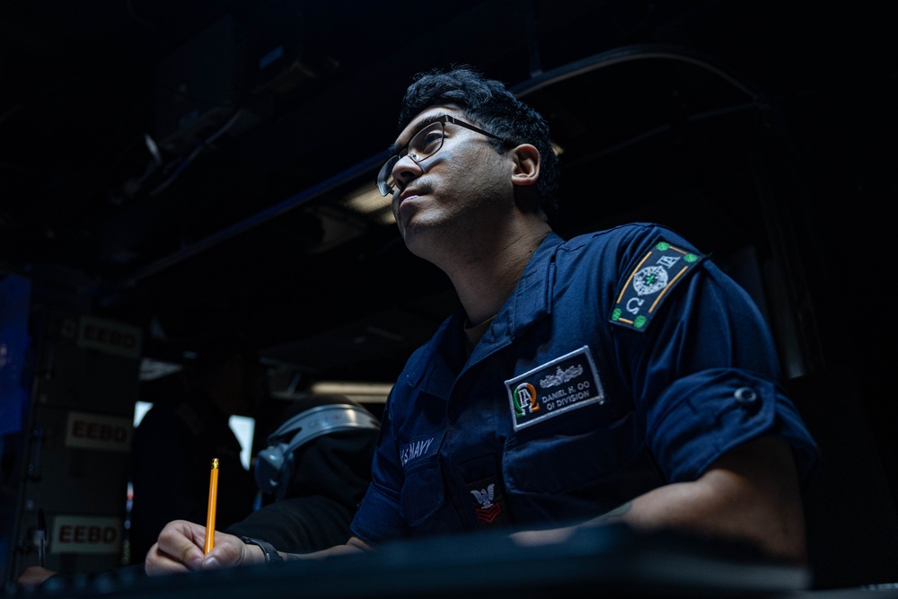 USS Mahan (DDG 72) Sailor Stands Combat Information Center Watch